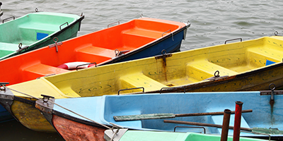 plastic rowing boats in different vibrant colors